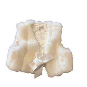 Cream colored warm winter vest designed by Helena